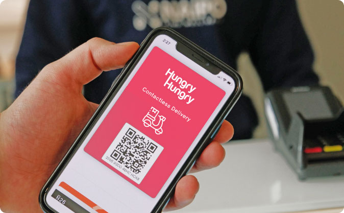 Person holding phone with HungryHungry delivery QR Code card on mobile interface